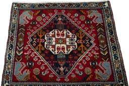 Surface texture of 2000s Shiraz rug with natural Wool and intricate pattern