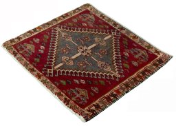 Corner detail of 2000s Shiraz rug showing border pattern and Wool pile