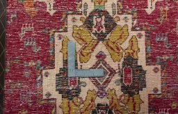 Backside of handmade 2000s Shiraz rug showing knot structure and weave density