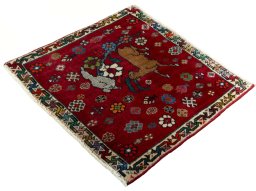 Corner detail of 2000s Shiraz rug showing border pattern and Wool pile