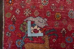 Backside of handmade 2000s Shiraz rug showing knot structure and weave density