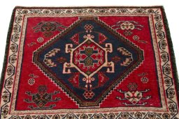 Surface texture of 2000s Shiraz rug with natural Wool and intricate pattern