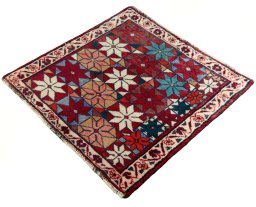 Corner detail of 2000s Shiraz rug showing border pattern and Wool pile