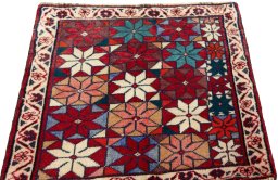 Surface texture of 2000s Shiraz rug with natural Wool and intricate pattern