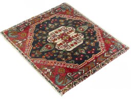 Corner detail of 2000s Shiraz rug showing border pattern and Wool pile