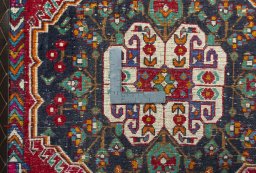 Backside of handmade 2000s Shiraz rug showing knot structure and weave density