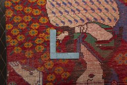 Backside of handmade 2000s Shiraz rug showing knot structure and weave density