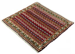 Corner detail of 2000s Shiraz rug showing border pattern and Wool pile