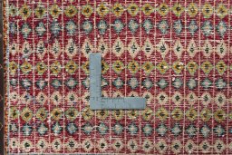 Backside of handmade 2000s Shiraz rug showing knot structure and weave density