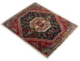 Corner detail of 2000s Shiraz rug showing border pattern and Wool pile