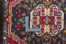 Backside of handmade 2000s Shiraz rug showing knot structure and weave density