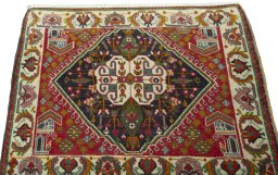 Surface texture of 2000s Shiraz rug with natural Wool and intricate pattern