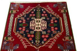 Surface texture of 2000s Shiraz rug with natural Wool and intricate pattern