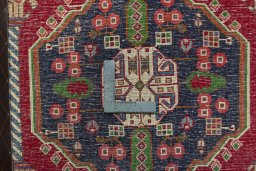 Backside of handmade 2000s Shiraz rug showing knot structure and weave density