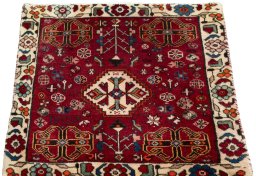 Surface texture of 2000s Shiraz rug with natural Wool and intricate pattern