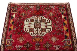 Surface texture of 2000s Shiraz rug with natural Wool and intricate pattern