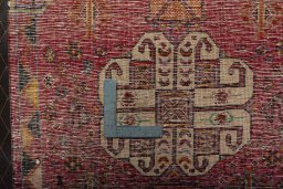 Backside of handmade 2000s Shiraz rug showing knot structure and weave density