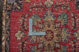 Backside of handmade 2000s Shiraz rug showing knot structure and weave density