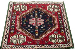 Surface texture of 2000s Shiraz rug with natural Wool and intricate pattern