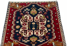 Surface texture of 2000s Shiraz rug with natural Wool and intricate pattern