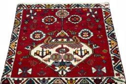 Surface texture of 2000s Shiraz rug with natural Wool and intricate pattern