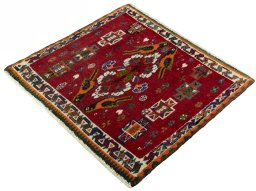 Corner detail of 2000s Shiraz rug showing border pattern and Wool pile