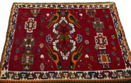 Surface texture of 2000s Shiraz rug with natural Wool and intricate pattern