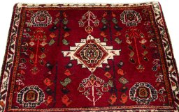 Surface texture of 2000s Shiraz rug with natural Wool and intricate pattern