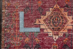 Backside of handmade 2000s Shiraz rug showing knot structure and weave density