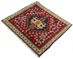 Corner detail of 2000s Shiraz rug showing border pattern and Wool pile