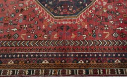 Corner detail of 2000s Shiraz rug showing border pattern and Wool pile