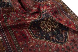 Surface texture of 2000s Shiraz rug with natural Wool and intricate pattern