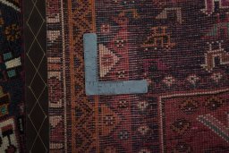 Backside of handmade 2000s Shiraz rug showing knot structure and weave density