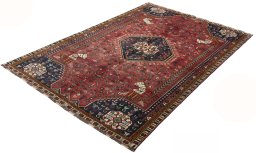 Corner detail of 2000s Shiraz rug showing border pattern and Wool pile