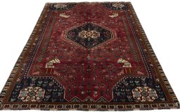 Surface texture of 2000s Shiraz rug with natural Wool and intricate pattern