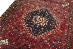 Backside of handmade 2000s Shiraz rug showing knot structure and weave density