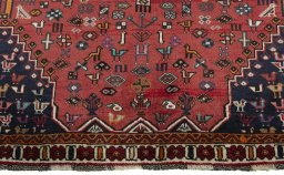 Full view of 2000s Shiraz rug from Iran / Persia, 297 × 189 cm in Red tones
