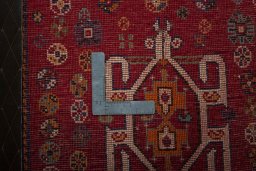 Backside of handmade 2000s Shiraz rug showing knot structure and weave density