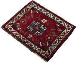 Corner detail of 2000s Shiraz rug showing border pattern and Wool pile