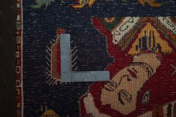 Backside of handmade 2000s Shiraz rug showing knot structure and weave density