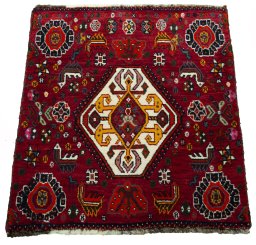Surface texture of 2000s Shiraz rug with natural Wool and intricate pattern