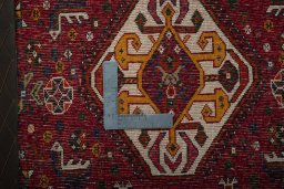 Backside of handmade 2000s Shiraz rug showing knot structure and weave density