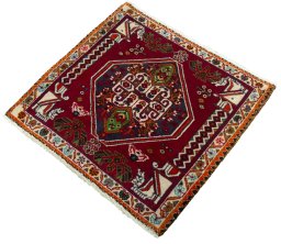 Corner detail of 2000s Shiraz rug showing border pattern and Wool pile