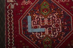 Backside of handmade 2000s Shiraz rug showing knot structure and weave density