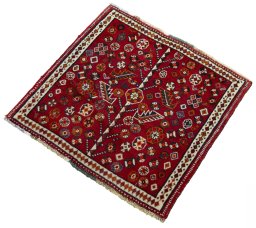 Corner detail of 2000s Shiraz rug showing border pattern and Wool pile