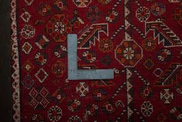 Backside of handmade 2000s Shiraz rug showing knot structure and weave density