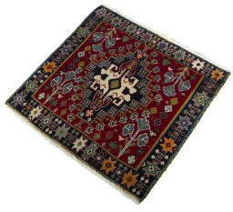 Corner detail of 2000s Shiraz rug showing border pattern and Wool pile