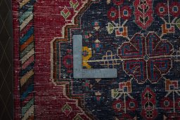Backside of handmade 2000s Shiraz rug showing knot structure and weave density