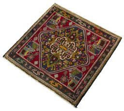 Corner detail of 2000s Shiraz rug showing border pattern and Wool pile