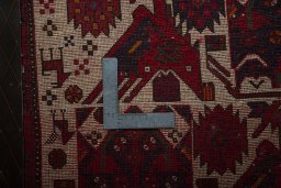 Backside of handmade 2000s Shiraz rug showing knot structure and weave density